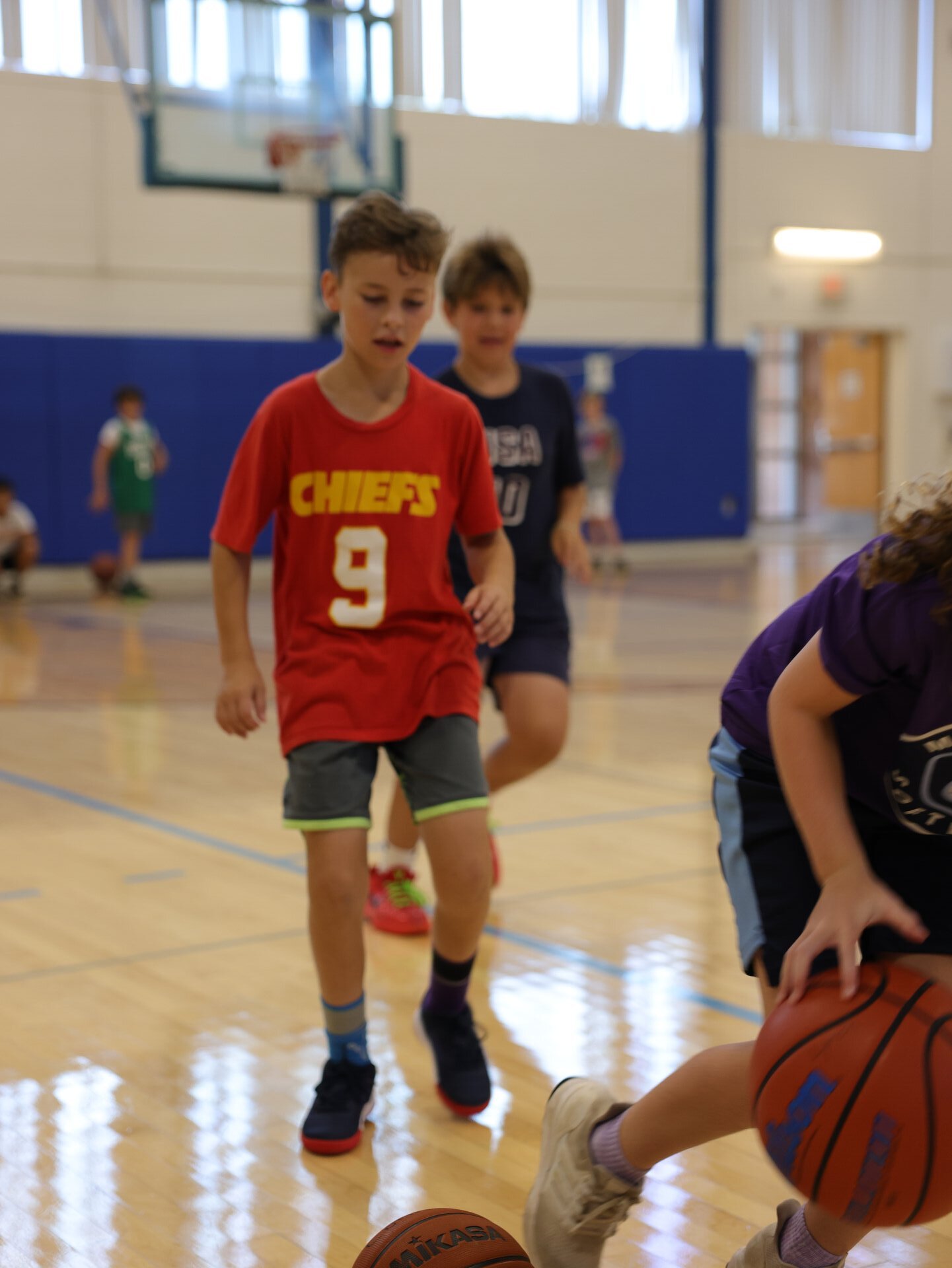 Youth basketball players at summer camp